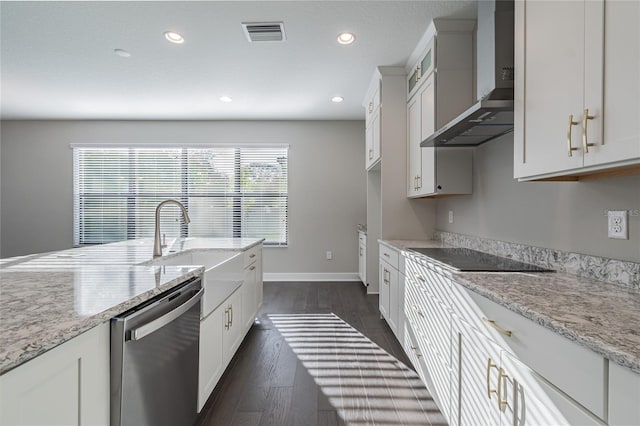 kitchen featuring black electric stovetop, dark wood-style flooring, visible vents, wall chimney range hood, and stainless steel dishwasher