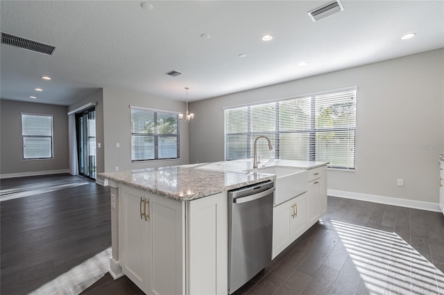 kitchen featuring a sink, white cabinetry, visible vents, and stainless steel dishwasher