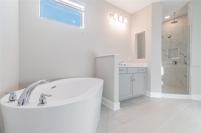 full bath with a marble finish shower, baseboards, a freestanding bath, and vanity