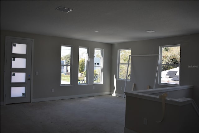 interior space with visible vents and baseboards