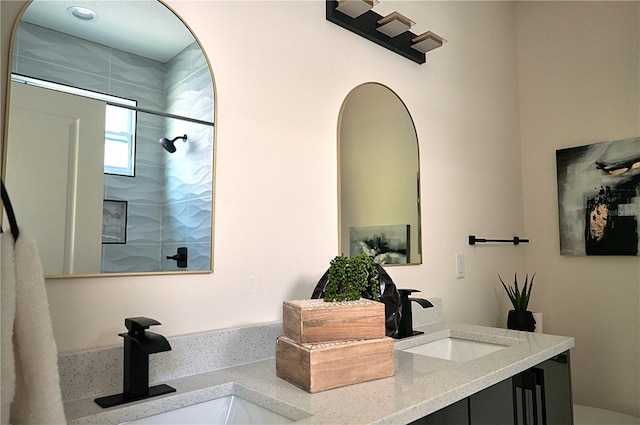 bathroom with an enclosed shower and vanity