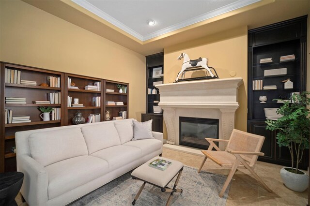 living room featuring tile floors, ornamental molding, and built in shelves