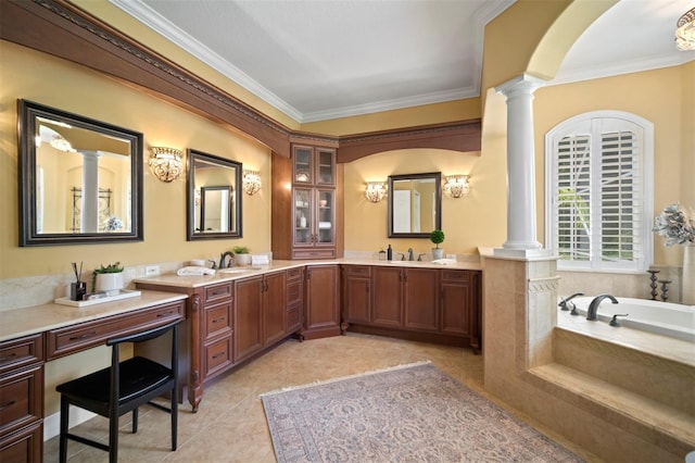 bathroom with tile floors, ornamental molding, tiled tub, and ornate columns