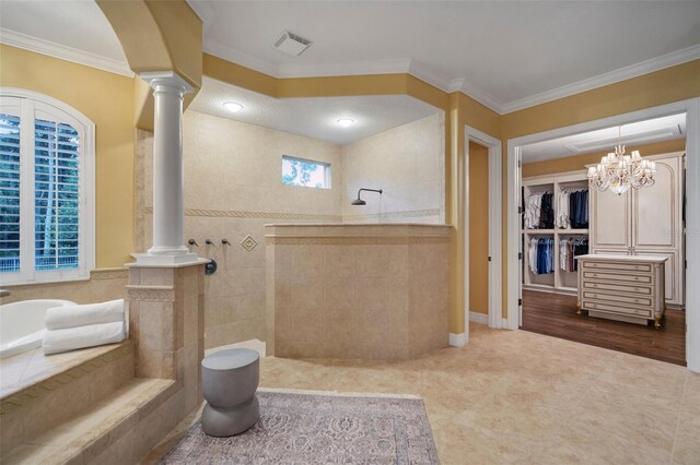 bathroom with crown molding, decorative columns, independent shower and bath, a notable chandelier, and tile floors