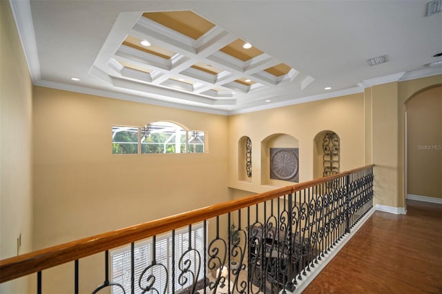 hall with coffered ceiling, crown molding, wood-type flooring, and beamed ceiling