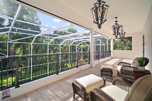 sunroom with an inviting chandelier