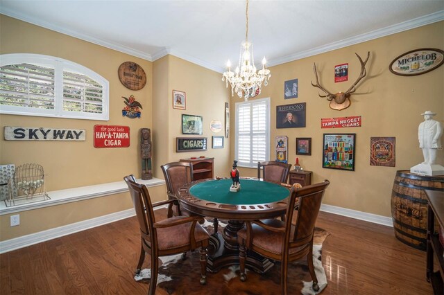 interior space featuring a notable chandelier, dark wood-type flooring, and ornamental molding