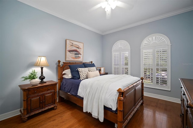 bedroom featuring dark wood-type flooring, ceiling fan, and crown molding