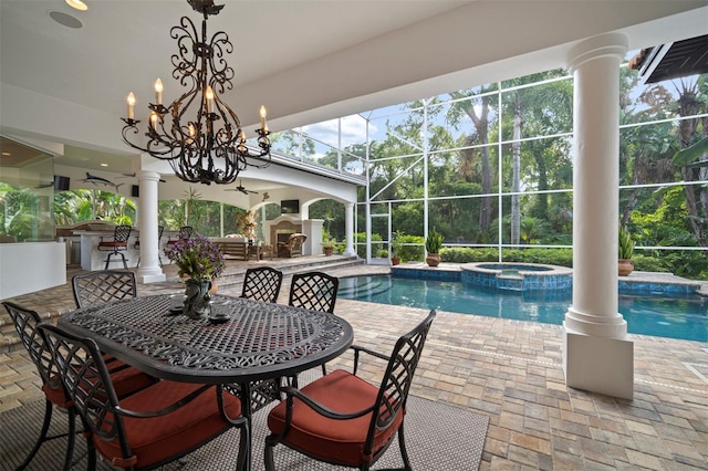 view of swimming pool with a patio, an in ground hot tub, ceiling fan, and exterior fireplace