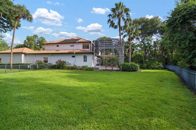 view of yard with a lanai