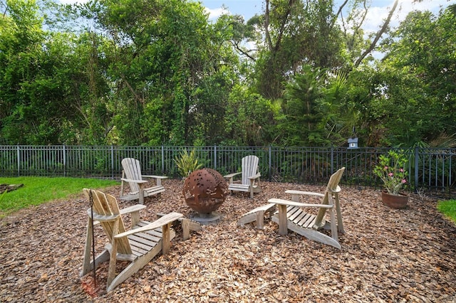 view of yard with a fire pit