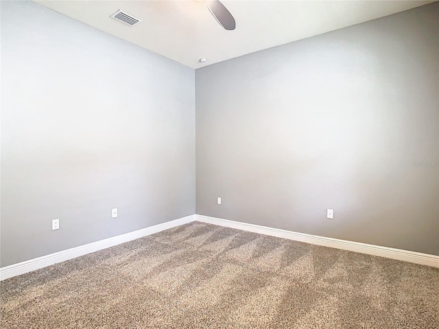 empty room featuring carpet and ceiling fan