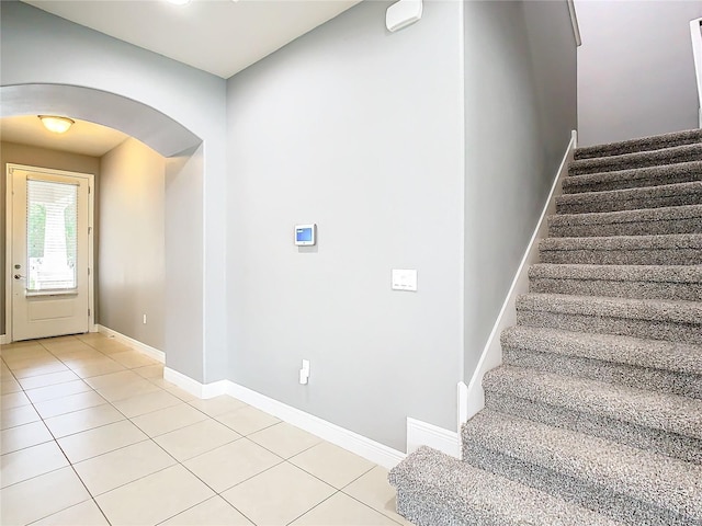 entrance foyer featuring light tile patterned flooring