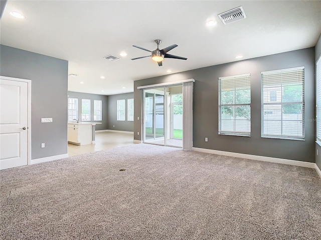 carpeted empty room with ceiling fan