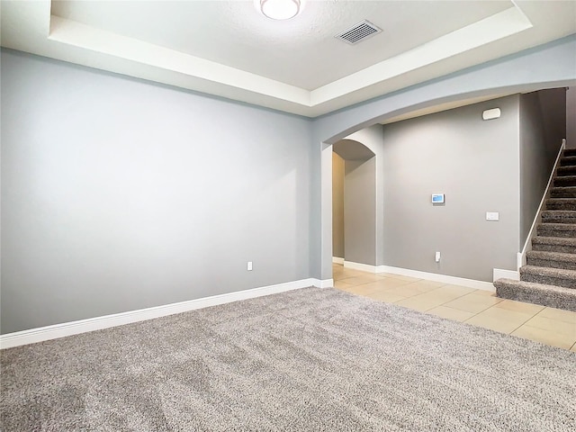 basement featuring light tile patterned flooring