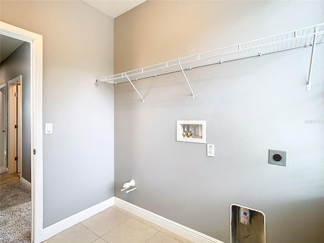 laundry area with washer hookup, light tile patterned floors, and electric dryer hookup