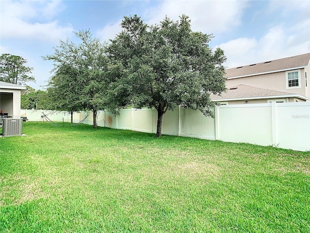 view of yard featuring central AC