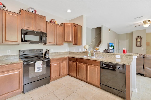 kitchen with kitchen peninsula, sink, light tile patterned flooring, and black appliances