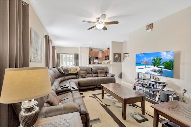 living room featuring ceiling fan and light carpet