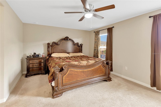 bedroom featuring ceiling fan and light colored carpet