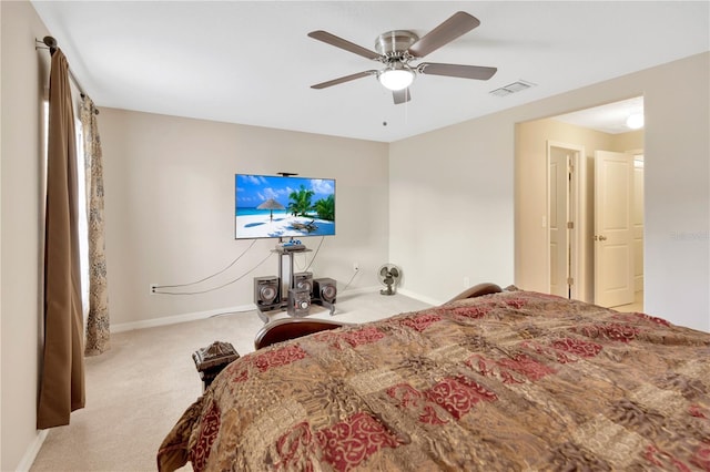 bedroom with ceiling fan and light colored carpet