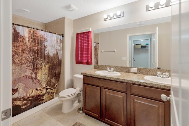 bathroom with tile patterned floors, vanity, toilet, and a shower with shower curtain