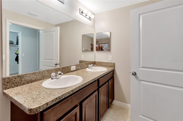 bathroom with tile patterned flooring and vanity