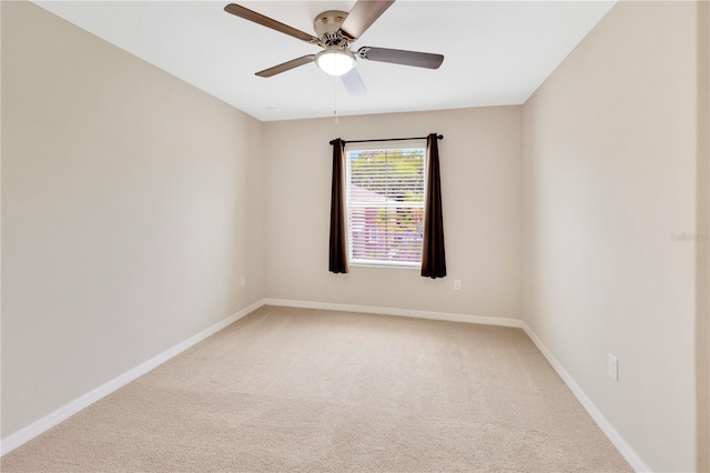 spare room with carpet flooring and ceiling fan