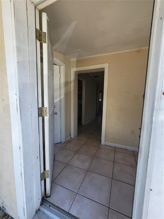 hall featuring tile patterned flooring