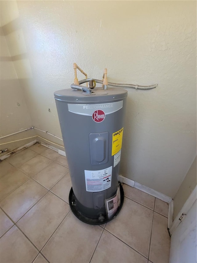 utility room with electric water heater