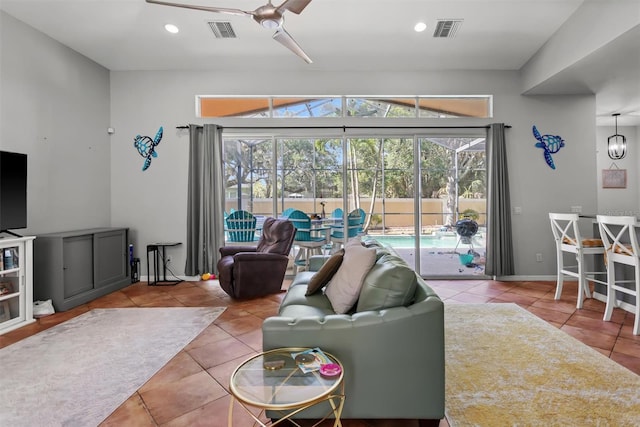 living room featuring tile floors and ceiling fan