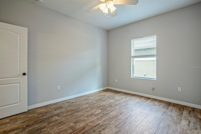 unfurnished room with wood-type flooring and ceiling fan