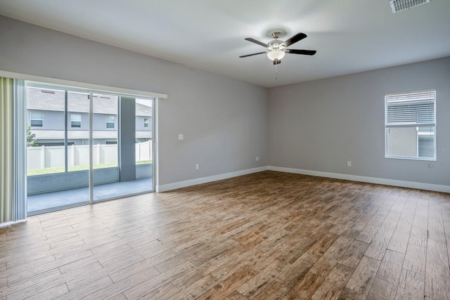 spare room with ceiling fan and light hardwood / wood-style flooring