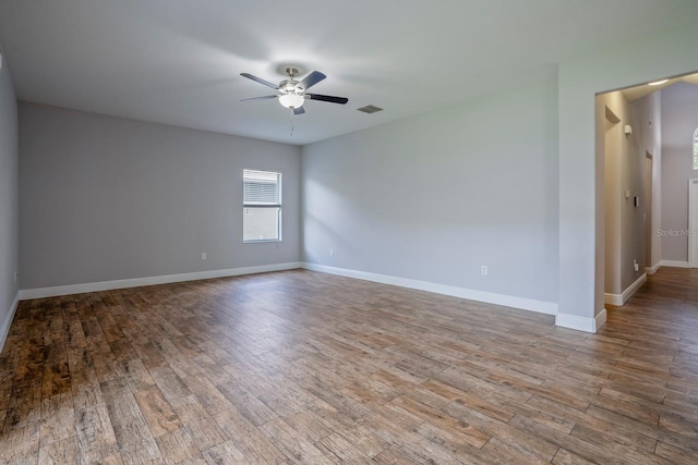 spare room with ceiling fan and hardwood / wood-style floors