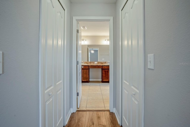 hallway featuring light hardwood / wood-style flooring