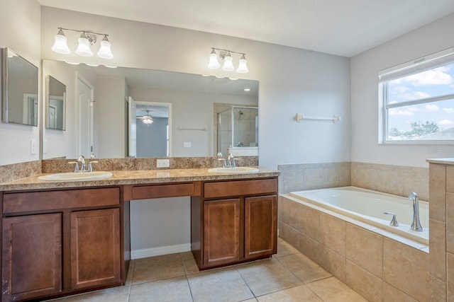 bathroom with plus walk in shower, tile patterned floors, and vanity