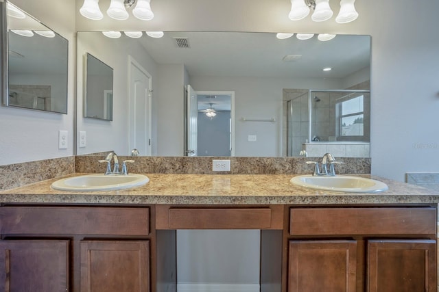 bathroom featuring walk in shower and vanity