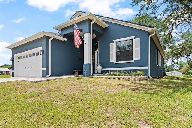 view of front facade with a garage and a front lawn