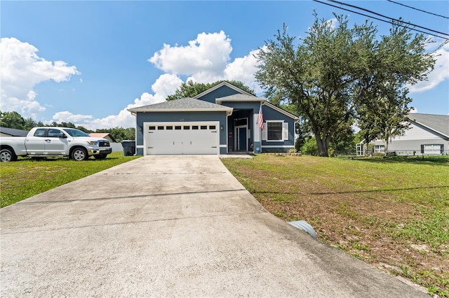 view of front facade featuring a garage and a front lawn