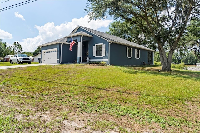 ranch-style home with a front yard and a garage