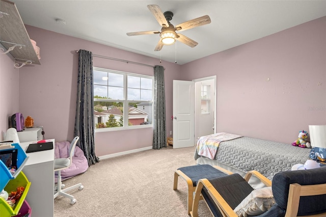 bedroom with light colored carpet and ceiling fan