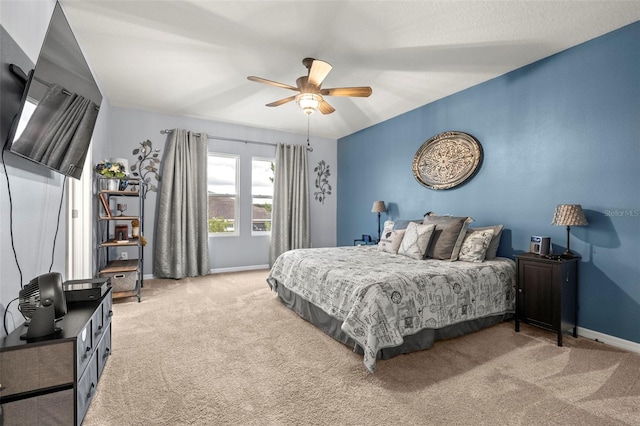 bedroom featuring light carpet and ceiling fan