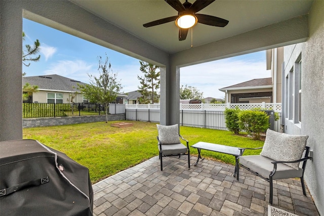 view of patio / terrace with area for grilling and ceiling fan