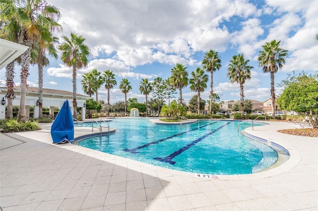 view of swimming pool with a patio