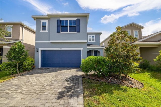 front facade with a garage