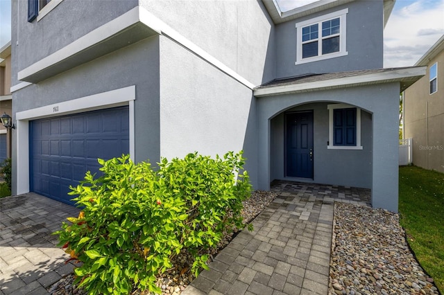 entrance to property featuring a garage