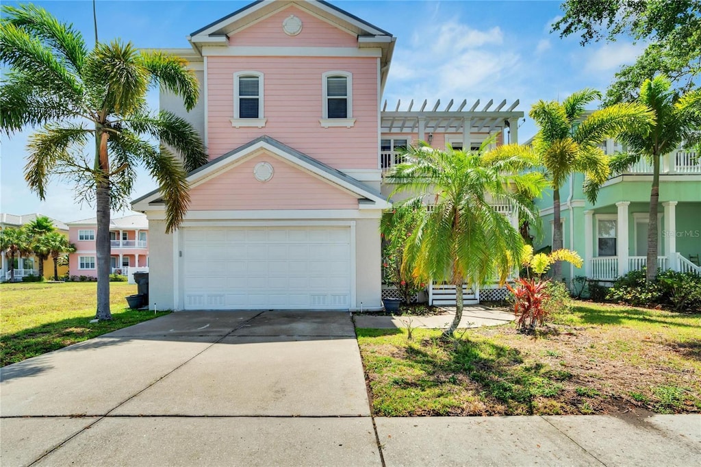 view of front of house with a garage and a front lawn