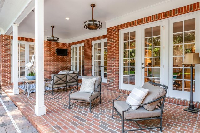 view of patio featuring french doors and an outdoor living space