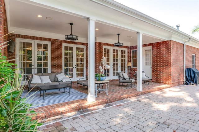 view of patio featuring an outdoor hangout area, grilling area, and french doors