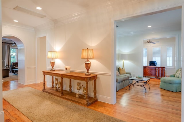 interior space featuring hardwood / wood-style floors and crown molding